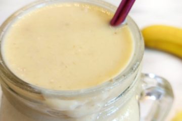 Glass containing mango and Pineapple Smoothie
