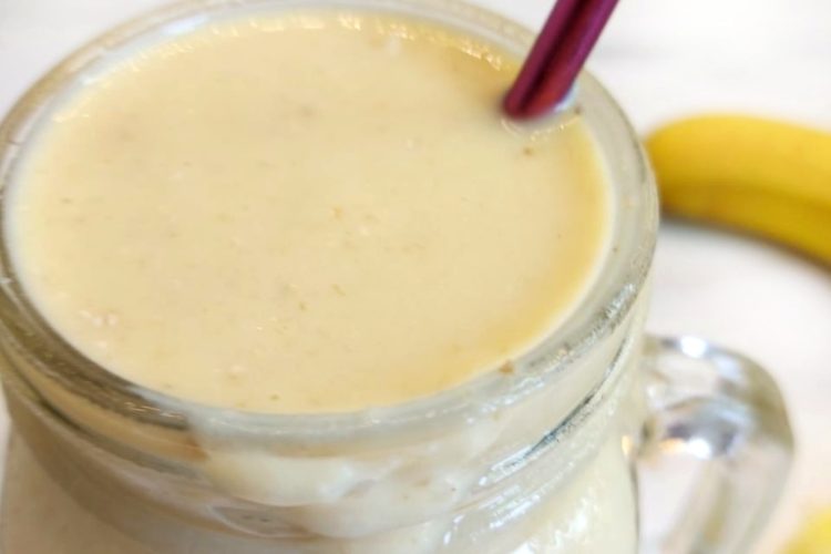 Glass containing mango and Pineapple Smoothie