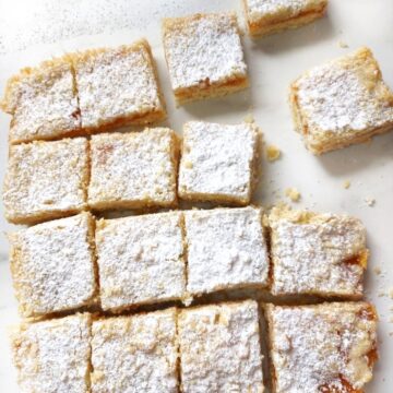 Vegan Apricot crumble bars traybake on a white surface