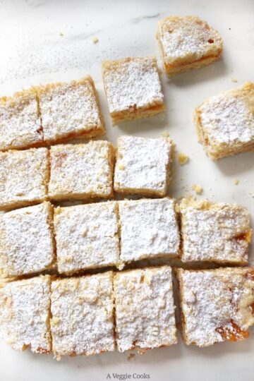 Vegan Apricot crumble bars traybake on a white surface
