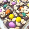 Vegan chocolate bars topped with salted peanuts and candied peanuts
