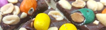 Vegan chocolate bars topped with salted peanuts and candied peanuts