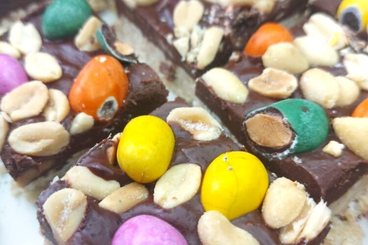 Vegan chocolate bars topped with salted peanuts and candied peanuts