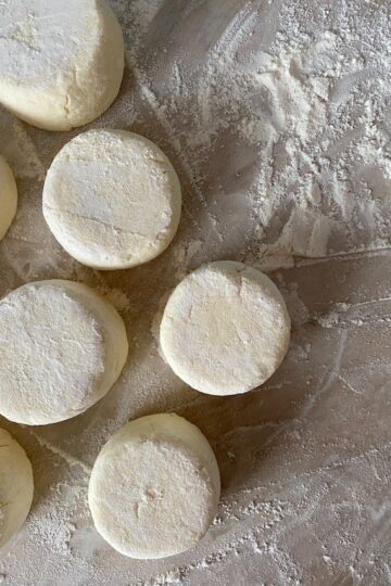Dough on a floured surface cut into rounds